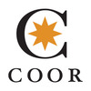 Logotyp med ett stort C i mitten. I C ryms en orange stjärna. Svarta bokstäver för företaget under.